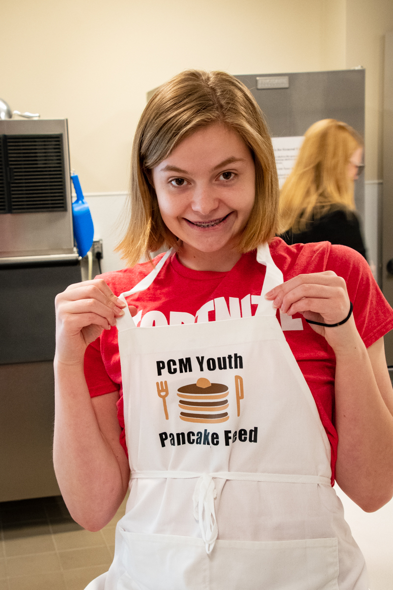 March 31, 2019:  Lucy Schonlau takes a moment to pose for the camera during a fundraising breakfast for the Youth trip to Triennium. 