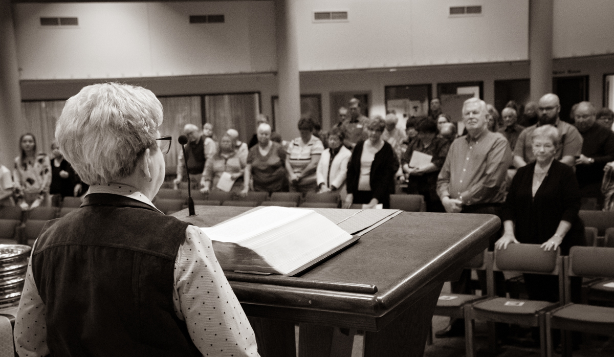 February 3, 2019:  Standing before the congregation, member Shirley Soss shares an announcement during the Worship service.