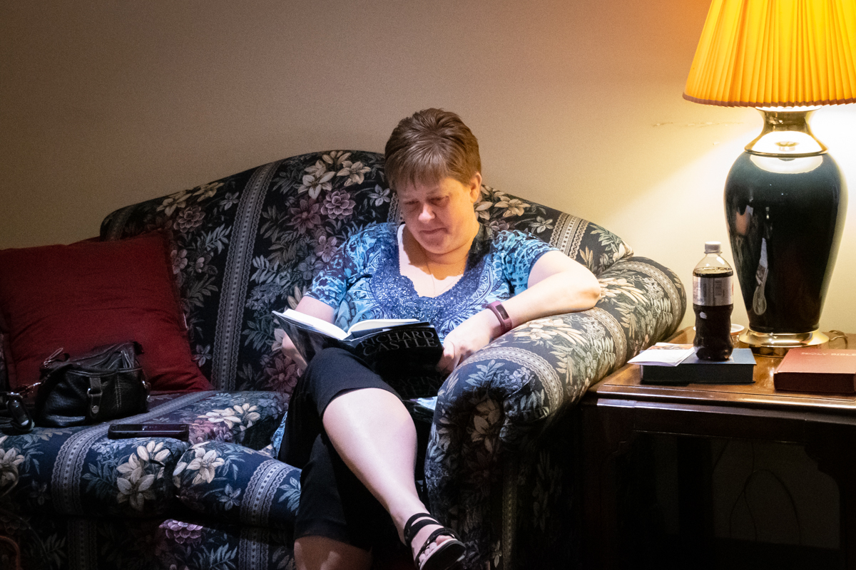 April 7, 2019:  In the quiet solitude of the Ware Room, member Marcy Kastrick takes some time to read and reflect.